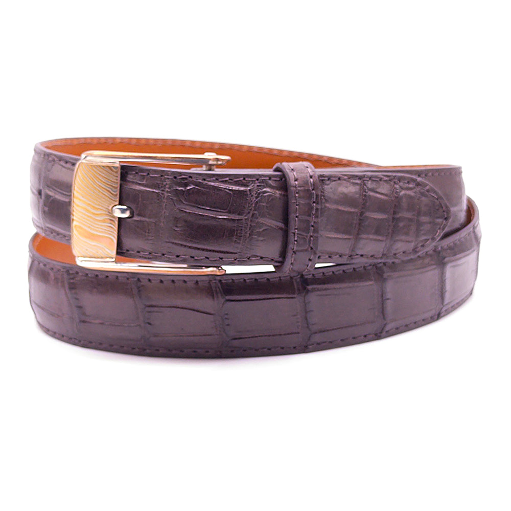 Neil Hunt Eugene sterling silver and Mokume-Gane belt buckle shown on a brown Nile crocodile belt strap.