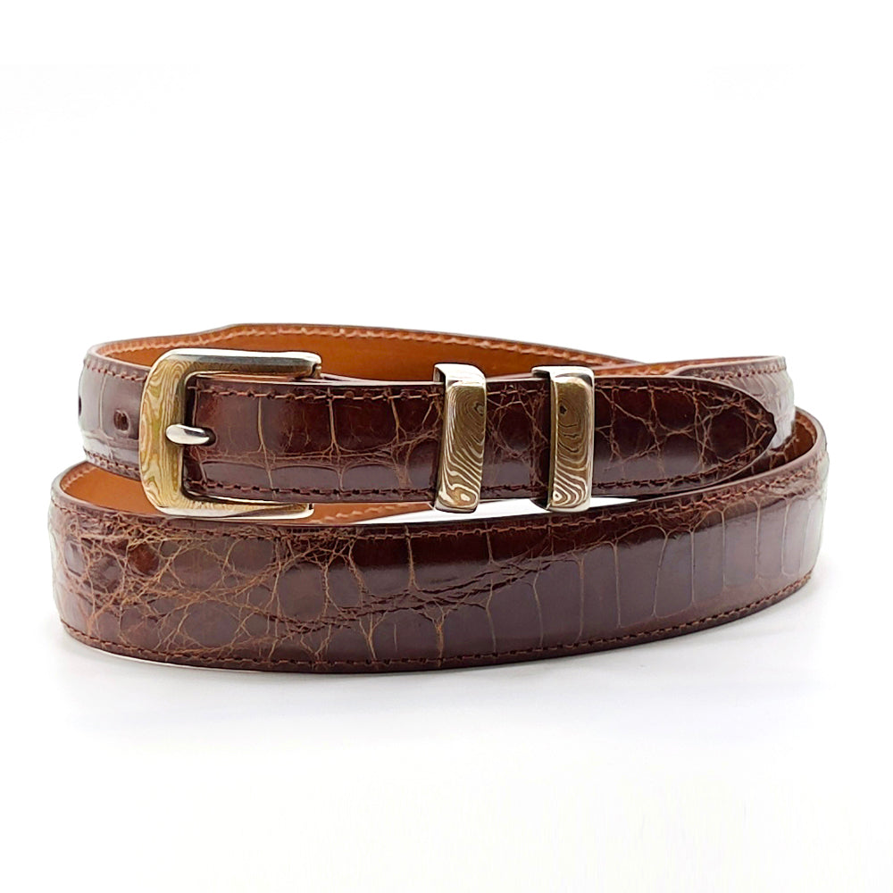 Neil Hunt Mokone-Gane bucke and keepers on a cognac alligator belt.
