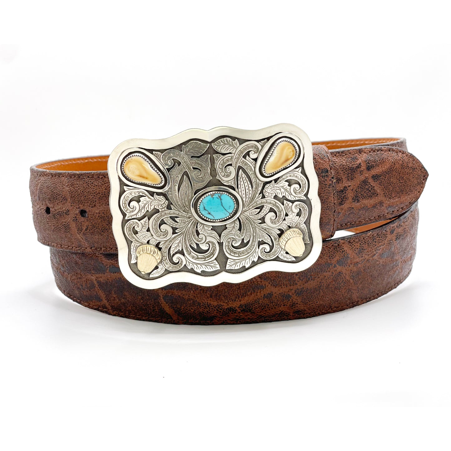 Richard Stump elk ivory and turquoise belt buckle shown on a bison belt.