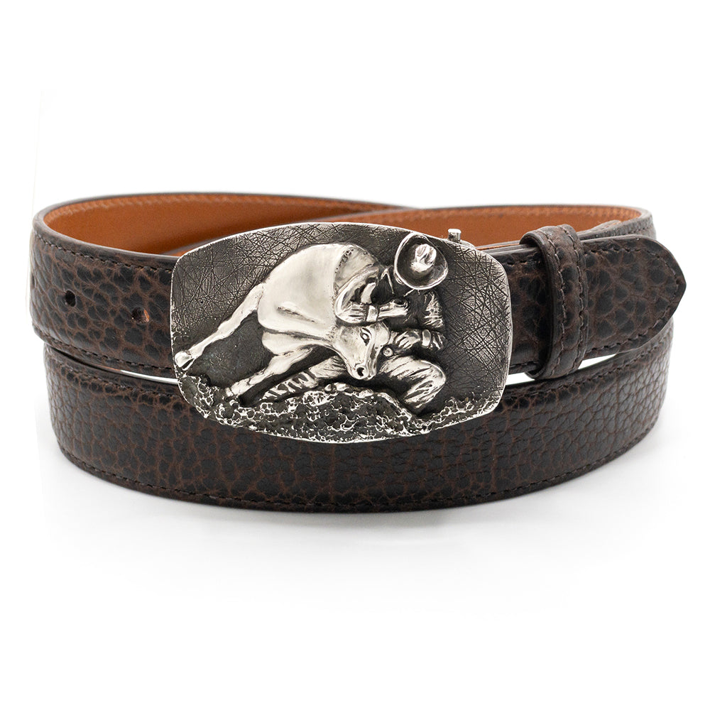 Gloria Stewart silver steer wrestling belt buckle shown on a brown bison blet.