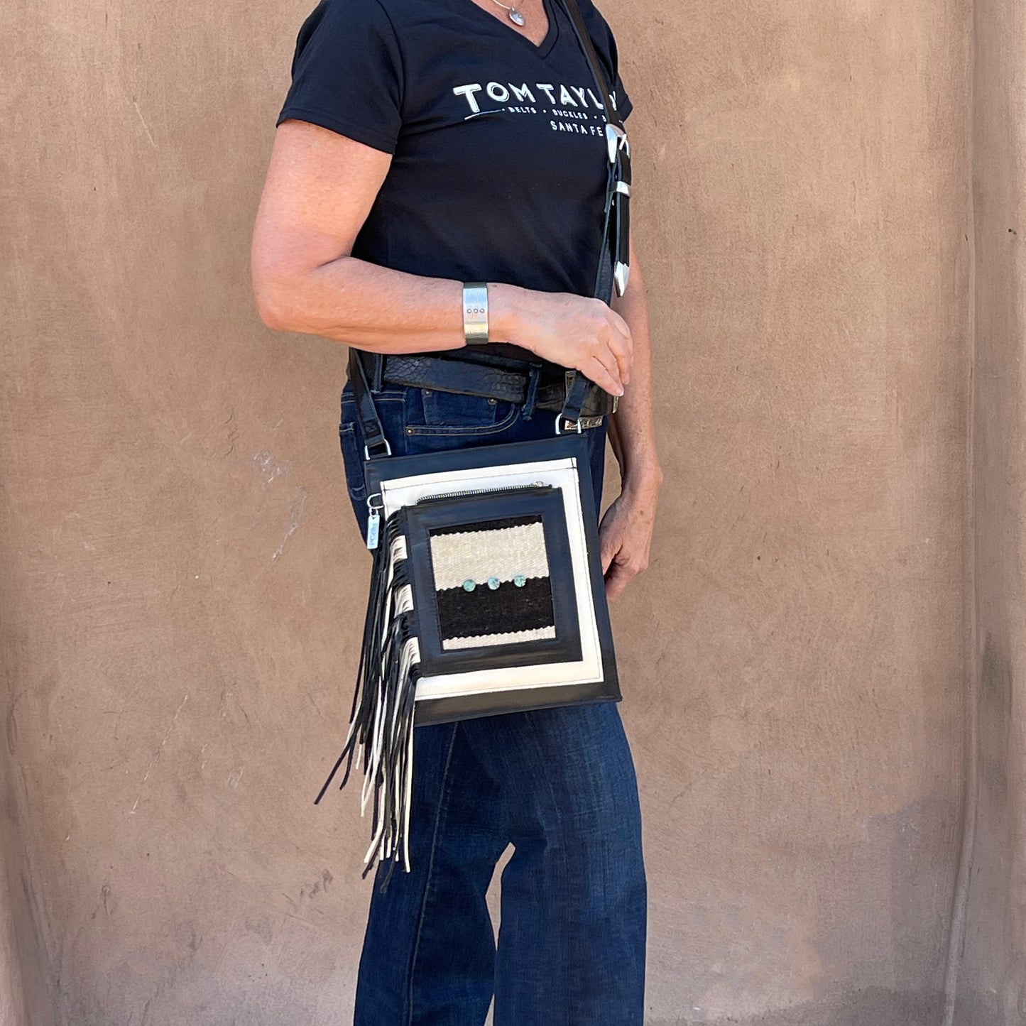 Woman wearing a Badolera crossbody bag.