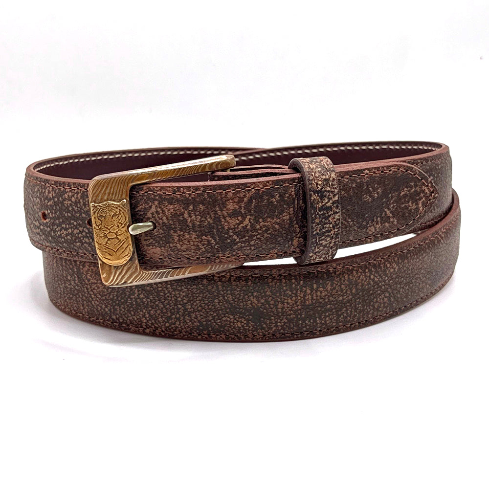 Neil Hunt Mokume-Gane buckle with a yellwo bronze tiger shown on a cape buffalo belt strap.