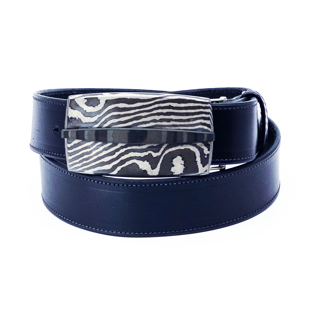 Pat Pruitt belt buckle on a black bridle leather belt.