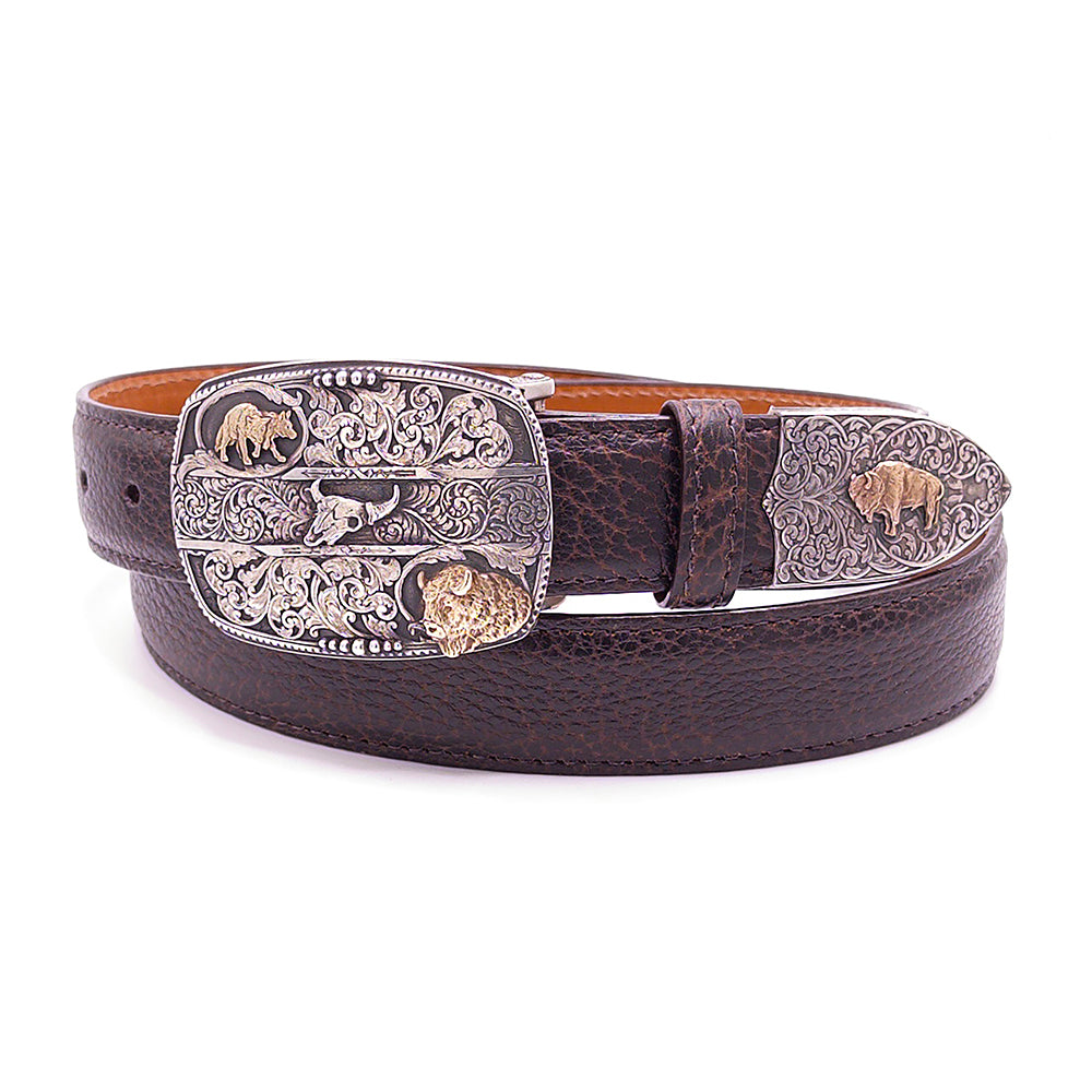 Sterling silver and 14K gold buffalo one piece belt buckle with tip on a brown bison belt.
