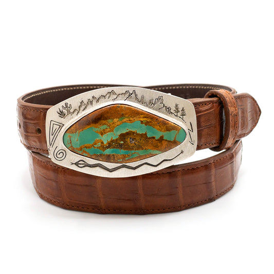 Gloria Stewart Royston turquoise belt buckle shown on a cognac crocodile belt strap.