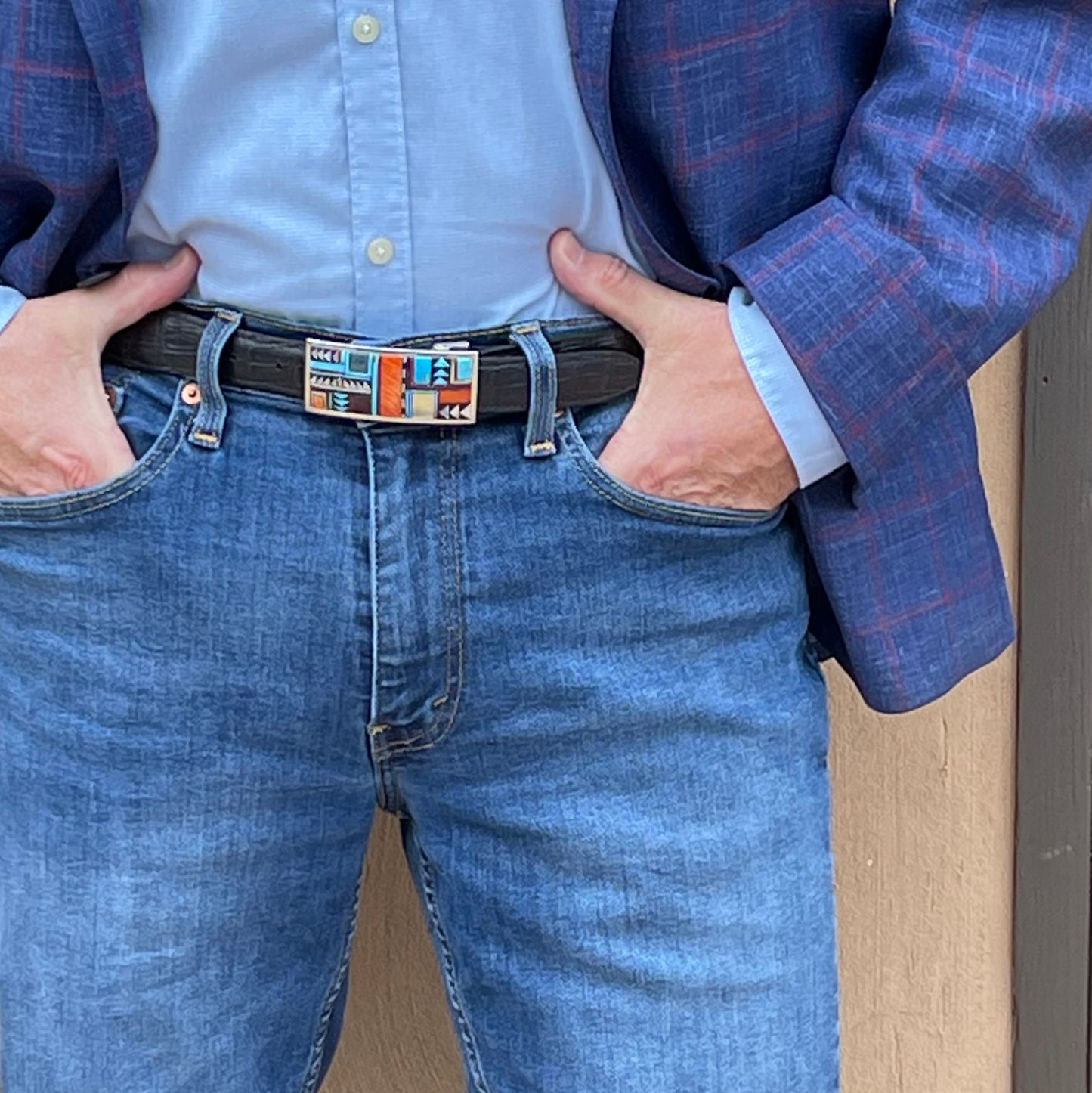 Waist view of man wearing Guild 07 belt buckle.