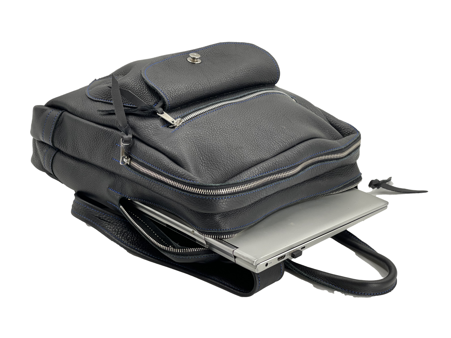 Interior view of black leather backpack with large laptop computer.
