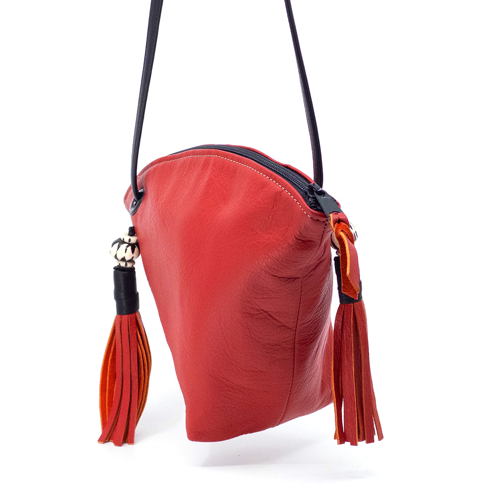 Side view or the red leather Fortune Cookie bag.