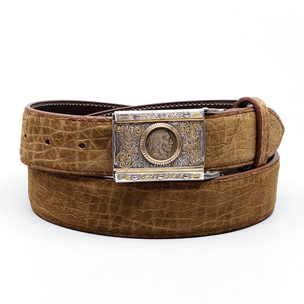 Neil Hunt Lakota Man belt buckle shown on a tan hippo belt strap.