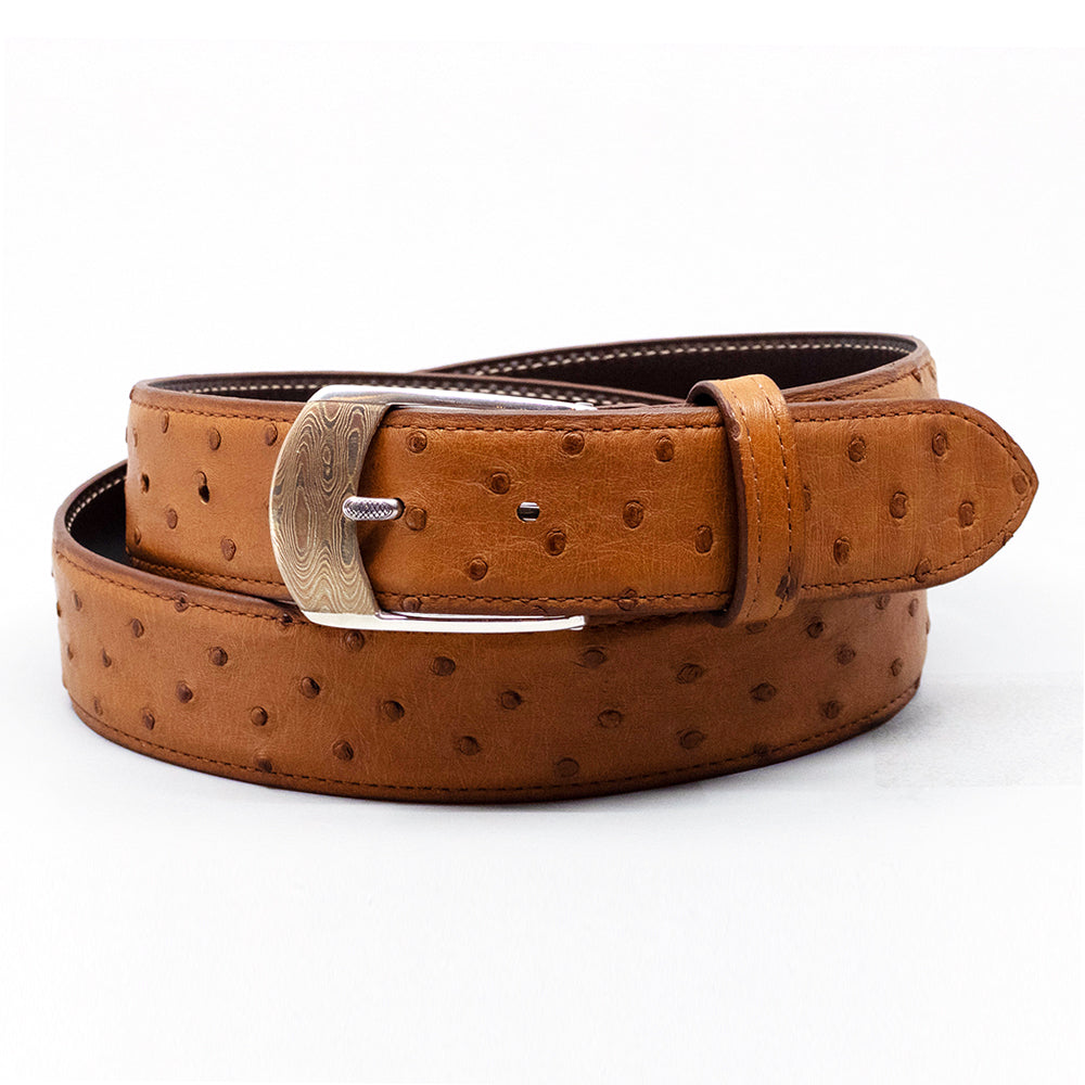 Neil Hunt Mokume-Gane buckle on a cognac saddle finish full quill ostrich belt strap.