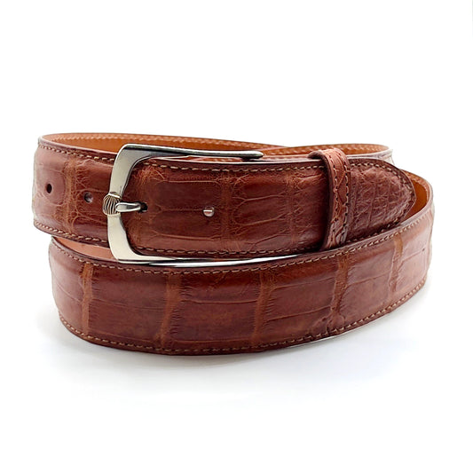 Neil Hunt Mokume-Gane buckle on a matte cognac alligator belt strap. 