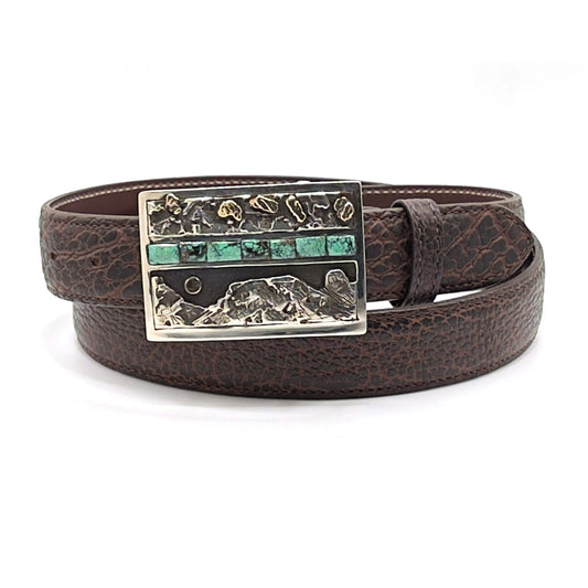 Richard Stump Moon Rise belt buckle shown on a brown bison leather belt strap.