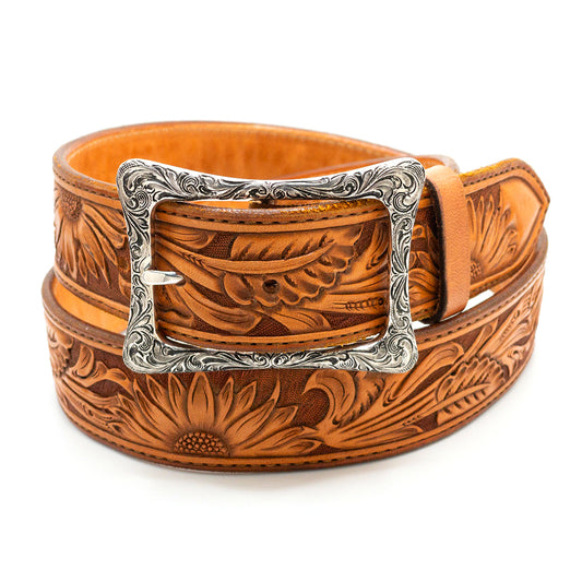 Engraved sterling silver Silver King garrison belt buckle shown on a tan hancarved belt strap.